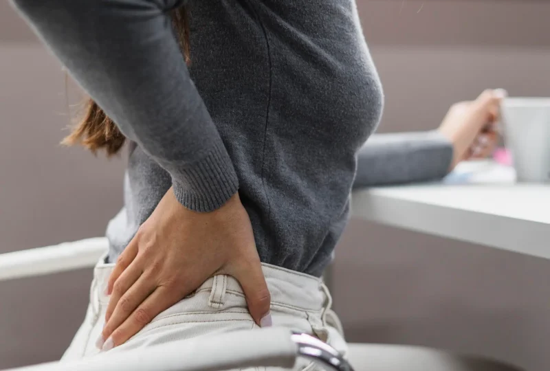 sideways-woman-having-backache-while-working-from-home